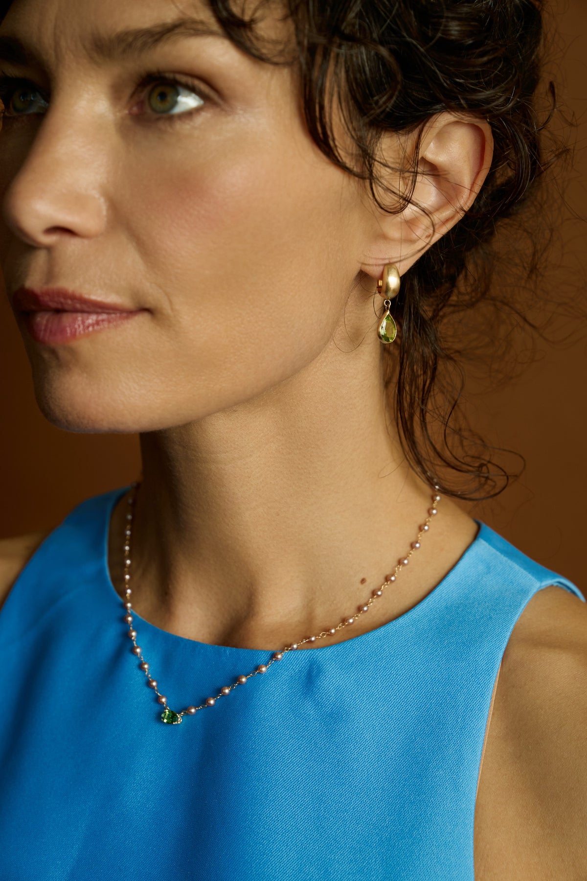 Malar Leaf Drops worn with a pink pearl and green stone necklace