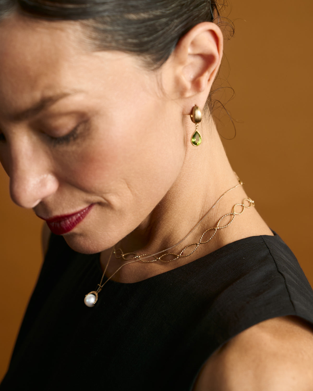 Malar Leaf Drops worn: peridot drop earring in 14k gold