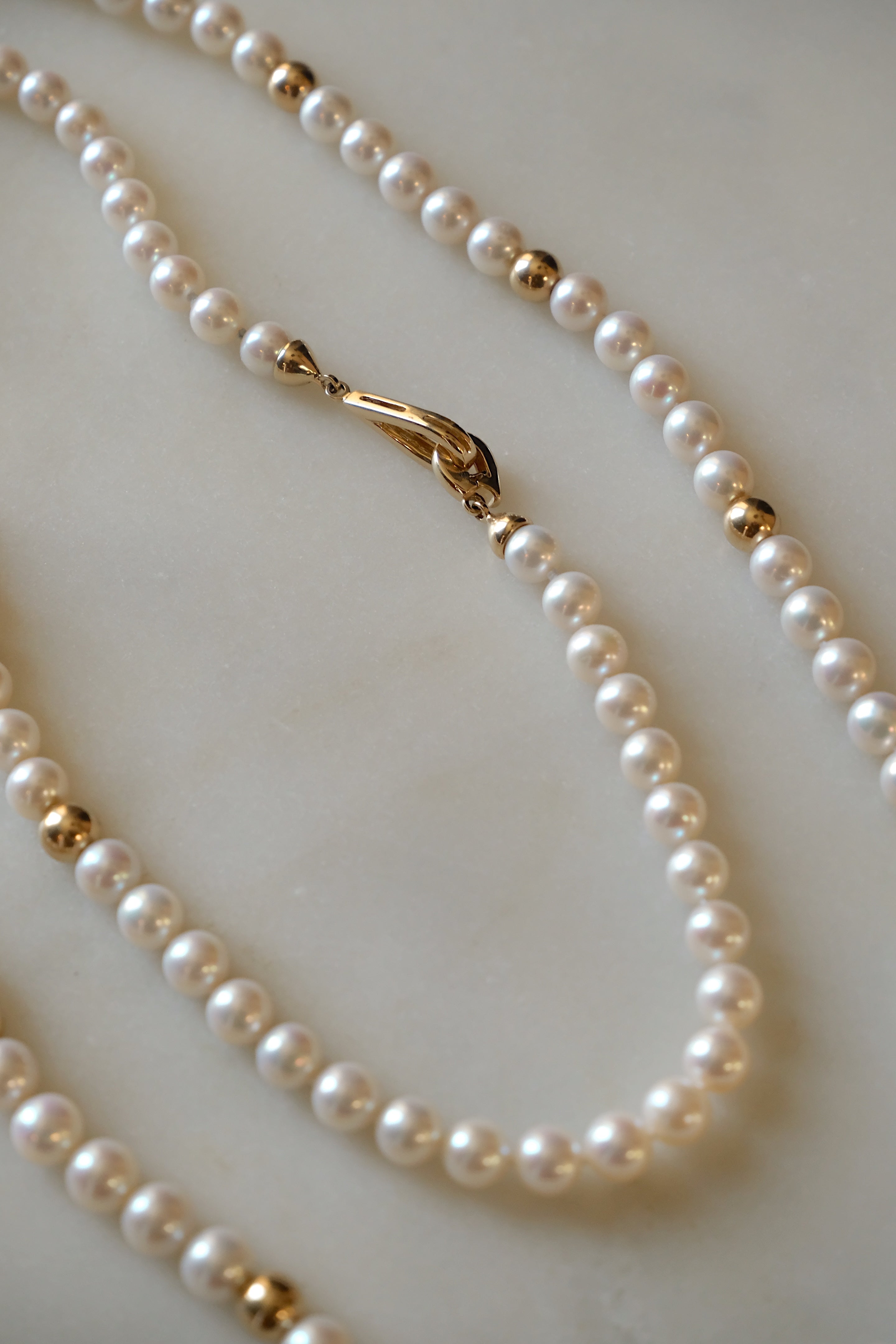 Sea Pearl Necklace – 40-inch freshwater pearl strand with 14k gold beads and foldover clasp